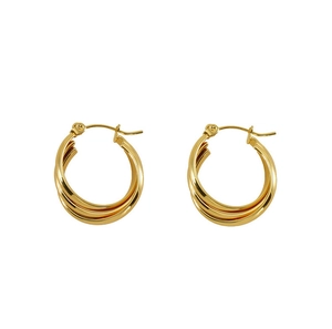 Detail of triple-layered golden stainless steel hoop earrings with geometric twisted design