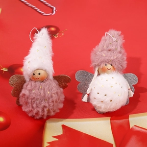 Plush Christmas angel hanging ornaments with golden wings on festive red background