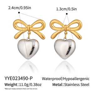 Detail view of gold bow and silver heart stainless steel earrings with measurements