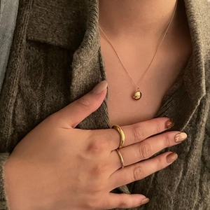 Elegant 925 sterling silver bean pendant necklace and gold rings set on model