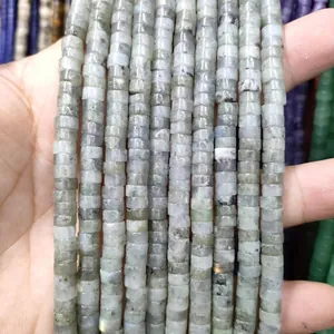 Macro detail of gray labradorite disk beads with natural texture and iridescent sheen