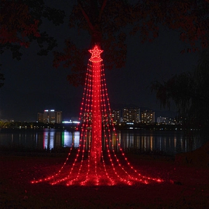 Outdoor red LED star waterfall lights hanging on a tree for garden decoration