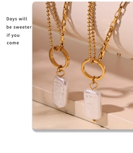 Detail shot of baroque pearl pendant on dual-layer 18k gold plated stainless steel chains