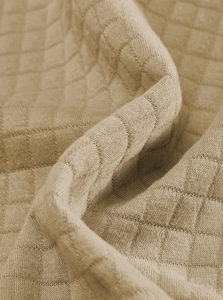 Macro shot of khaki waffle knit fabric texture on men's stand collar long sleeve pullover