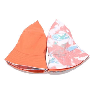 Tie-dye and solid orange reversible bucket hats for sun protection and outdoor fashion