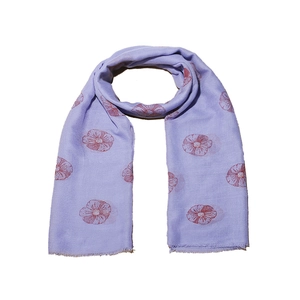 Detailed close-up of lavender floral print scarf featuring delicate fringe and soft fabric