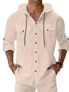 Detail of men's linen beach shirt showing hood drawstring and double chest pockets