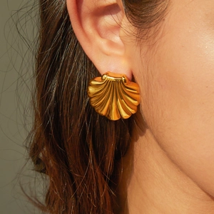 Elegant 18k gold plated fan-shaped shell earrings for women shown on a model