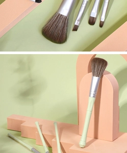 Detailed macro view of matcha green makeup brushes with soft brown gradient bristles