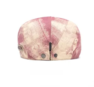 Detail of the tie-dye cotton beret cap back with adjustable metal buckle and GSIOR tag