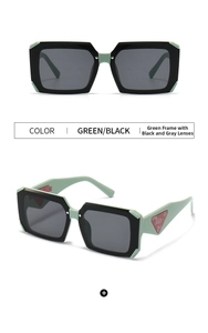 Detail view of green vintage square sunglasses with wide temples and red triangle logo