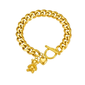 Gold-plated stainless steel chain bracelet with bear and heart charms and toggle clasp
