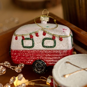 Vintage camper van Christmas tree ornament with festive red and white glitter coating