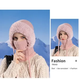 Pink knit balaclava hat with faux fur trim and integrated face mask for winter warmth
