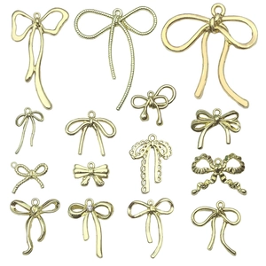 Golden bow charms in various textures and styles for DIY jewelry and accessory making