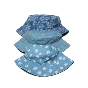 Women's summer denim bucket hats featuring floral and maple leaf patterns in blue shades