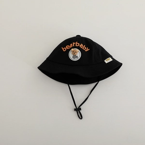Close-up of black cotton baby sun hat with orange bearbaby embroidery and teddy bear patch
