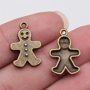 Antique bronze gingerbread man charms for DIY necklaces with hollow back and front detail