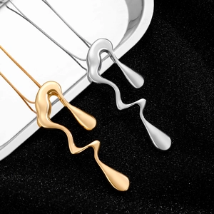 Artistic golden and silver fluid lava pendants on long chains for stylish layering