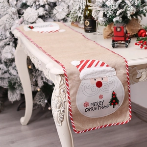 Linen Christmas table runner with Santa design and Merry Christmas text for dining decor