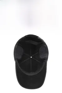 Detailed top view of winter baseball cap showing thick wool fabric and foldable ear flaps