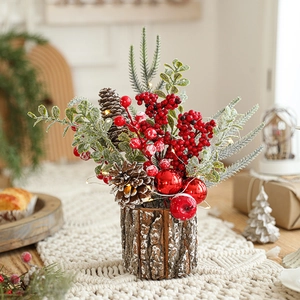 Christmas centerpiece with red berries and pine cones on a glowing LED wooden base