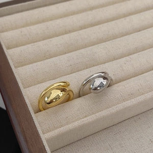 Minimalist double layer smooth gold and silver rings displayed on velvet jewelry box