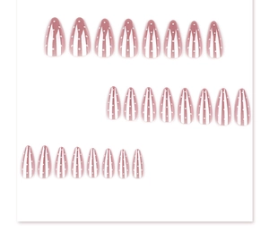 Flat lay showing nude and white almond press-on nails with polka dots and stripes