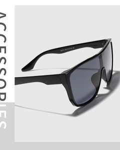Detail shot of black shield sunglasses showing model 20270 and CE markings on the temple