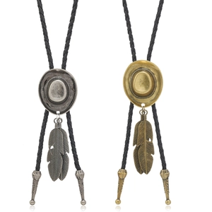 Vintage western bolo ties in silver and bronze with cowboy hat and feather charms