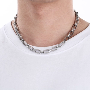 Polished silver rectangular link chain worn by male model showing minimalist design