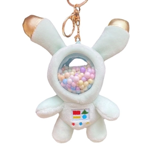 Cute plush astronaut bunny keychain in green spacesuit with colorful beads in helmet