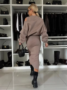 Detailed view of the vertical rib-knit texture on a stylish long-sleeved top and skirt set