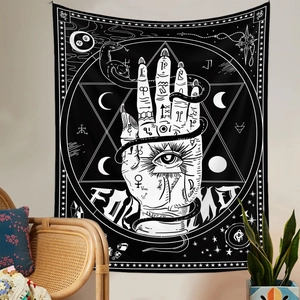 Detail view of monochrome mystical tapestry featuring palm, snake and celestial symbols