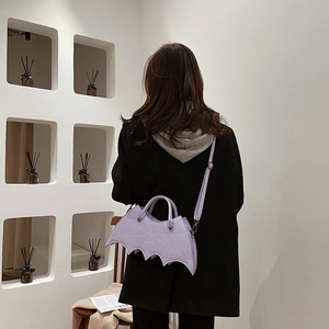 Gothic bat-shaped purple PU leather crossbody bag with spider web embroidery detail