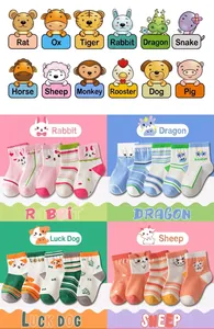 Close-up of children's cotton socks with cartoon zodiac animals and colorful patterns