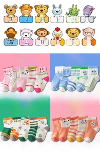 Close-up of children's cotton socks with cartoon zodiac animals and colorful patterns