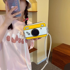 Retro camera-shaped crossbody bag in yellow and white colorblock with a thin strap