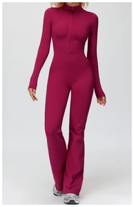 Front full-view of burgundy long sleeve flared yoga jumpsuit with a half-zip high collar