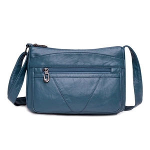 Sac à bandoulière bleu en cuir souple pour femmes avec multi-poches et fermeture éclair