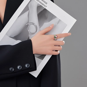 Minimalist silver open ring with colorful rainbow zircon stones shown on hand