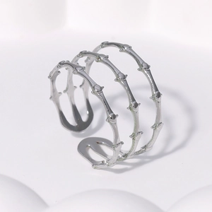 Adjustable silver stainless steel bamboo style ring with a minimalist multi-layered design