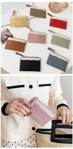 Detailed view of colorful PU leather coin purses with zipper and top white stitching