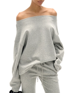 Close-up of premium grey knitted cotton fabric and stitching on casual two-piece set