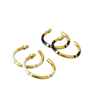 Minimalist C-shaped brass earrings with gold plating and black white enamel finish
