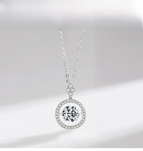 Detail of 925 sterling silver necklace featuring a dancing zircon stone in a halo setting