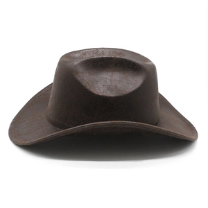 Close-up of the vintage faux suede texture and wide brim on a dark brown cowboy hat