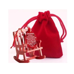 Red miniature wooden rocking chair with memorial tag and velvet pouch for Christmas