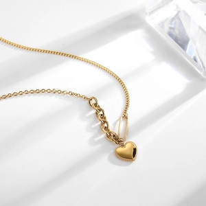 Gold heart pendant necklace in titanium steel with unique asymmetric chain design