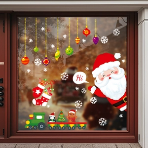 Christmas window stickers set with Santa, snowflake, train and sock on glass surface